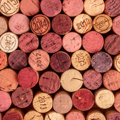 Stacked wine corks showing vintage years