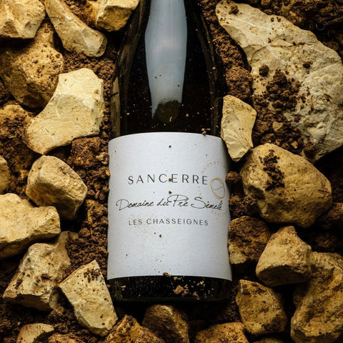 Wine bottle from the Loire Valley resting in a pile of rocks